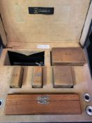 Two boxes of standard brass weights
