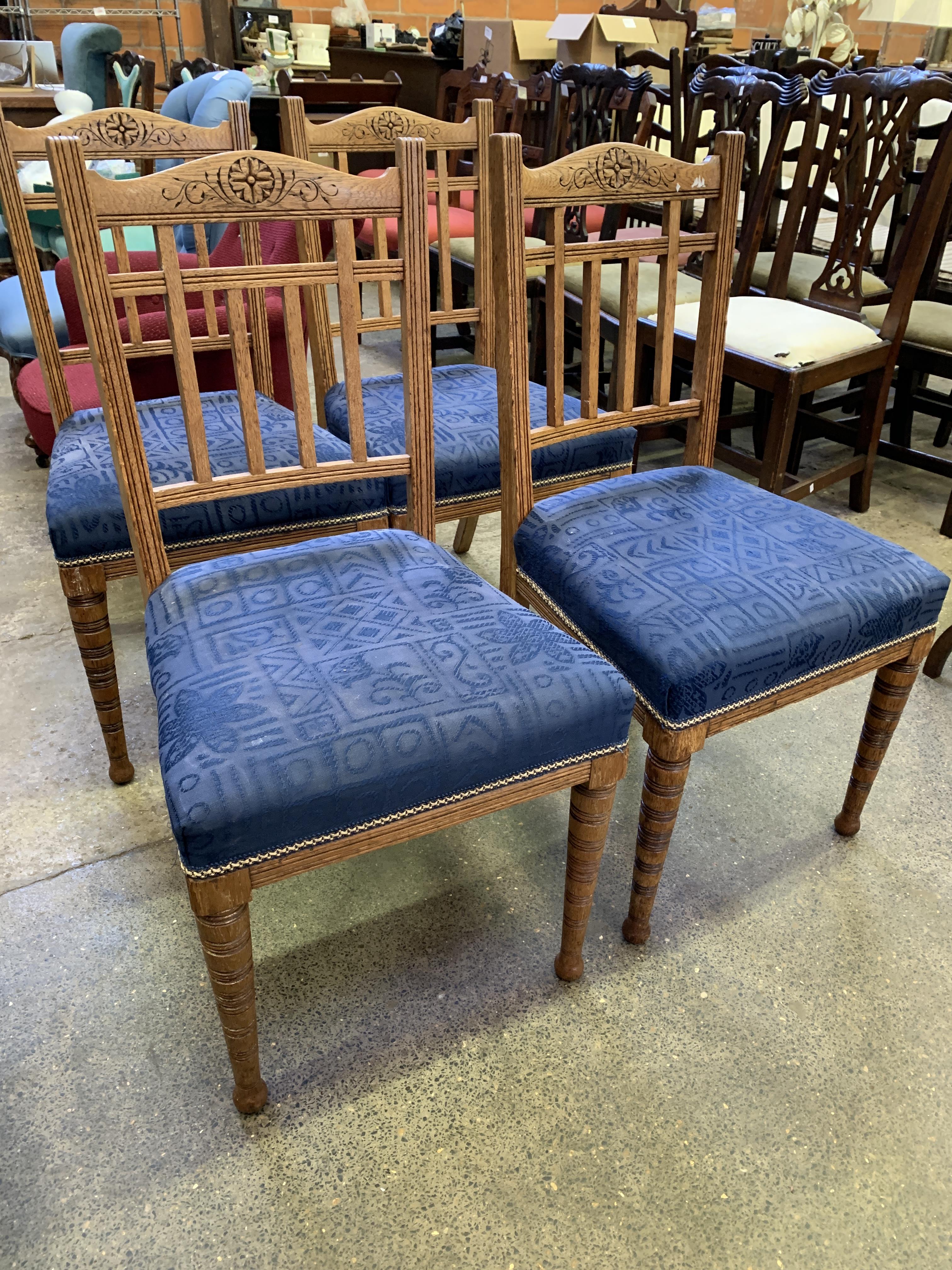 Four oak dining chairs
