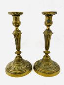 A pair of brass candlesticks