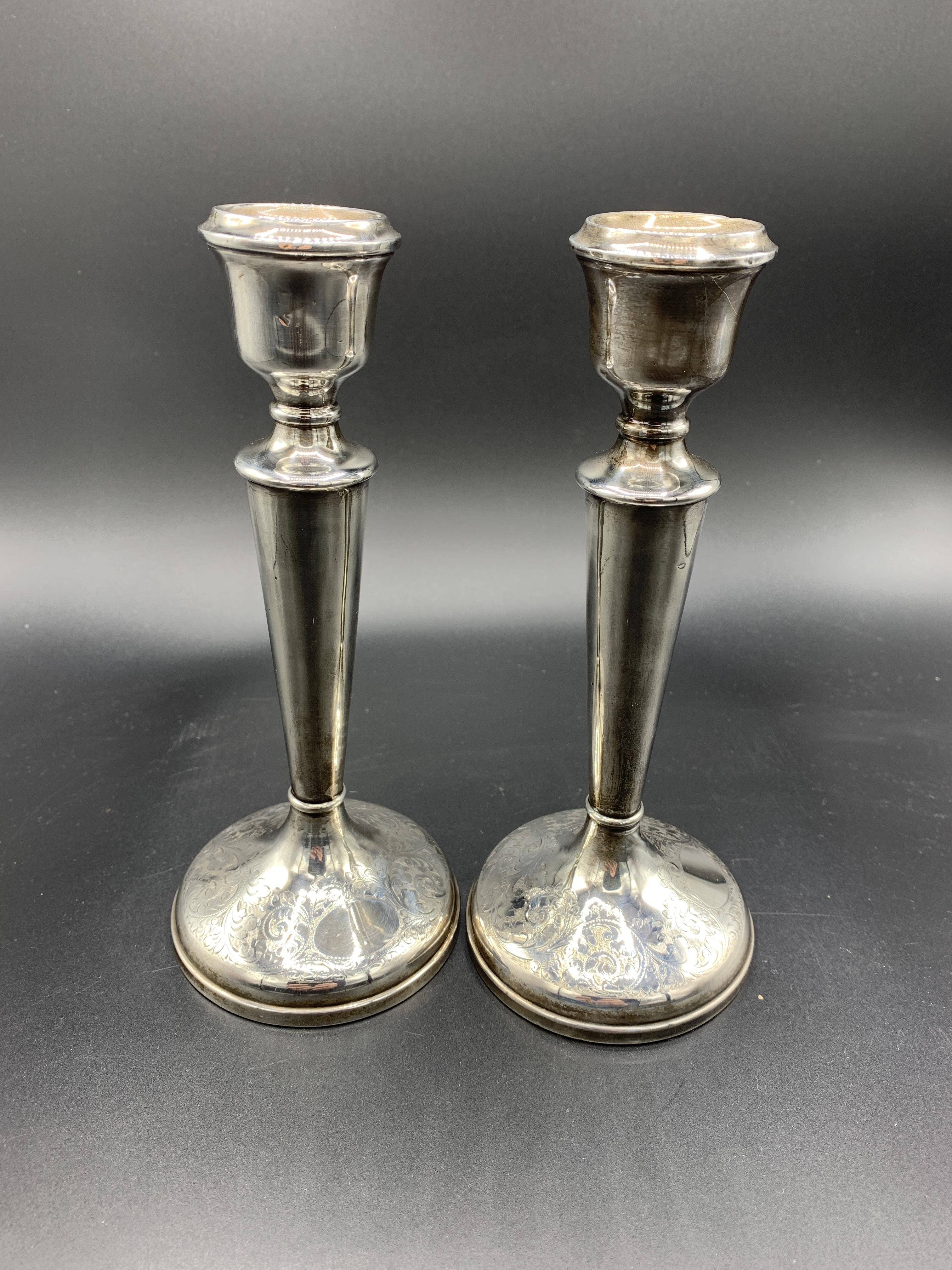 A pair of silver candlesticks by Charles S Green & Co Ltd