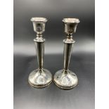 A pair of silver candlesticks by Charles S Green & Co Ltd