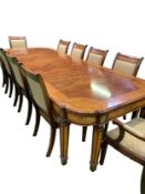 Walnut and mahogany veneer extendable dining table by Charles Barr Furniture with 10 chairs