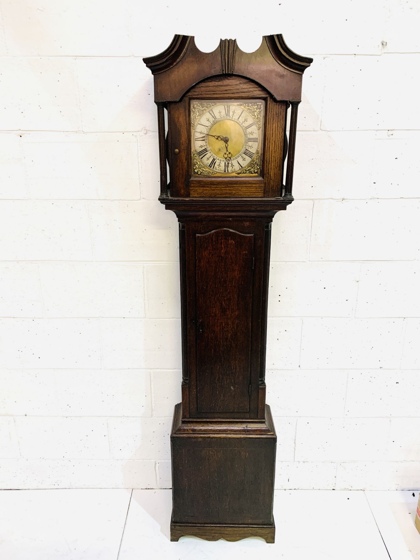 Early to mid-eighteenth century mahogany long case clock with brass face engraved R Maddock, Leek,