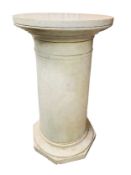 A tapered carrara marble column