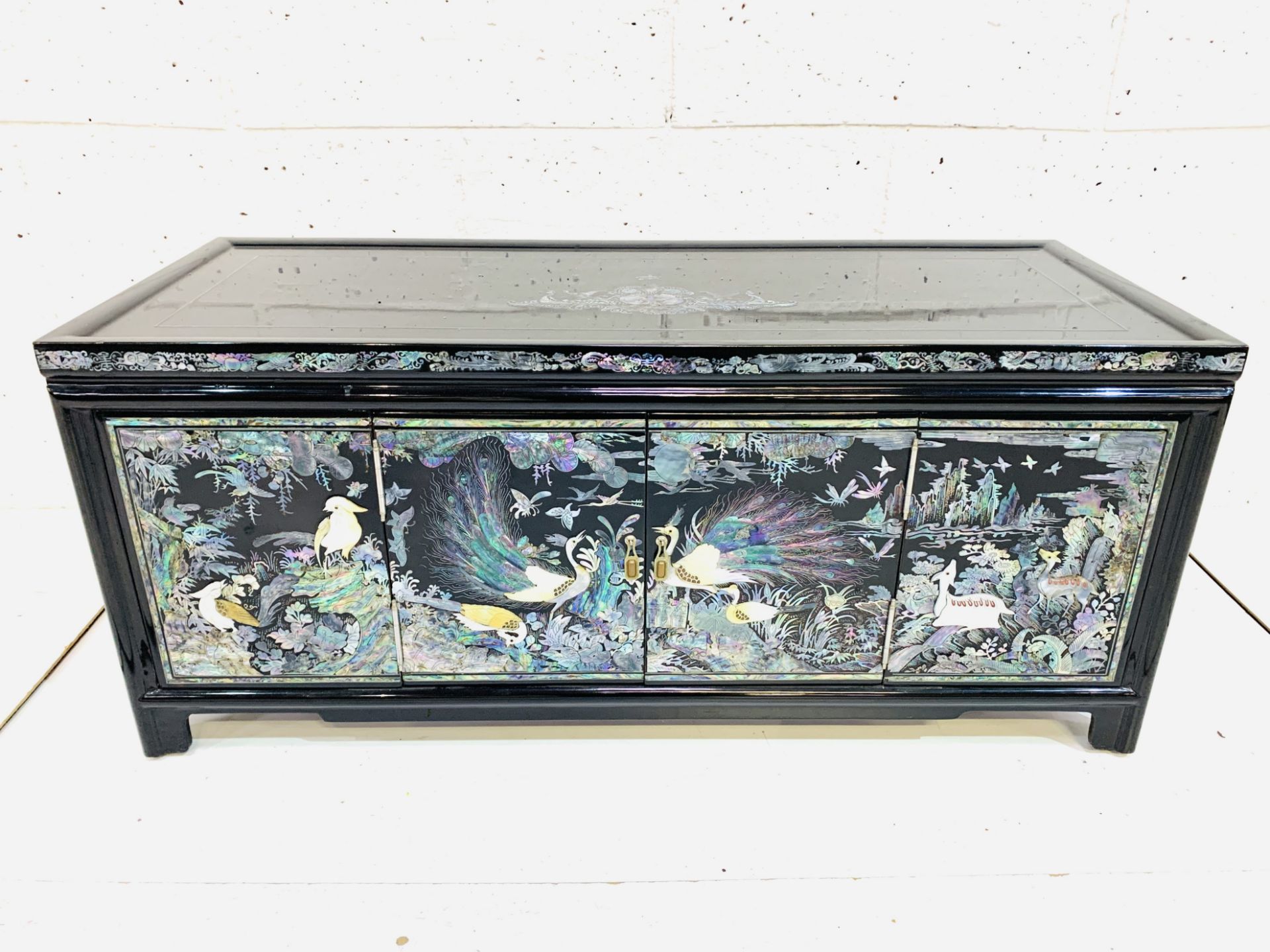 Asian cabinet decorated with mother of pearl
