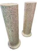 A pair of rose marble columns