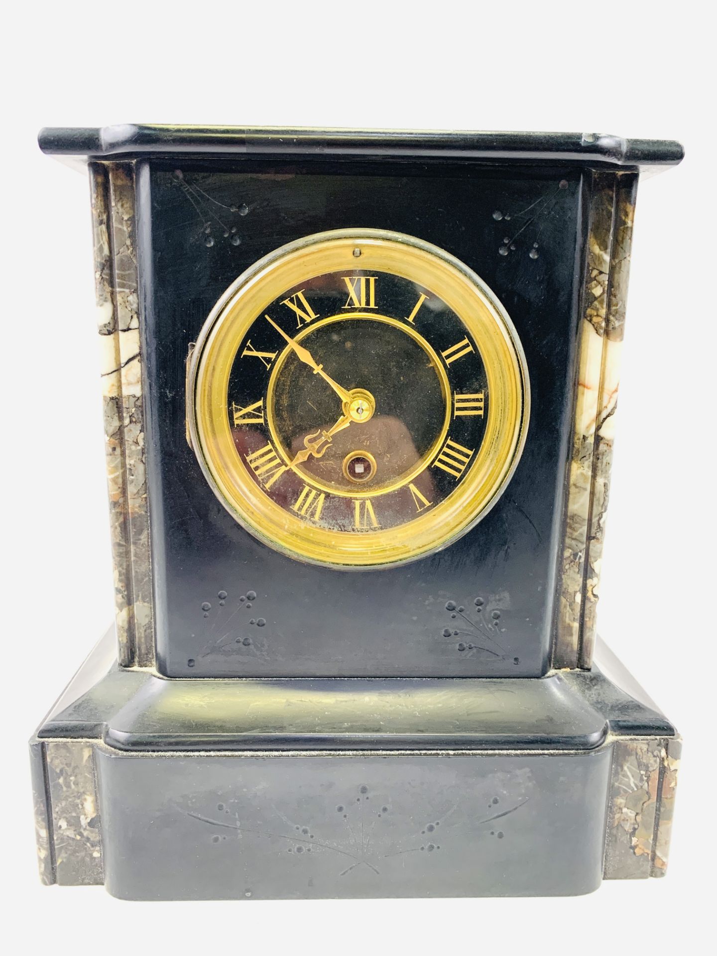 A slate cased mantel clock