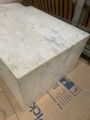 A rectangular block of calacatta marble