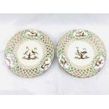 Pair of Meissen style hand painted porcelain plates with pierced rims