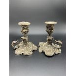 A pair of mid-19th century rococo silver plate candle holders by Elkington & Co