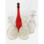 A pair of cut glass decanters together with two others