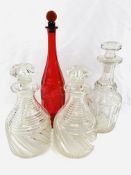 A pair of cut glass decanters together with two others