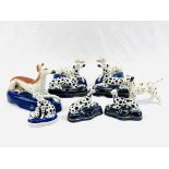 A collection of Staffordshire dogs together with a Beswick dog