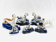 A collection of Staffordshire dogs together with a Beswick dog