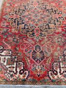 Red and beige ground Iranian wool rug