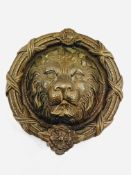 Brass door knocker in the form of a lion''s head