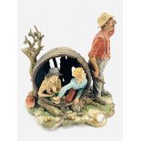 Capodimonte model of two children hiding