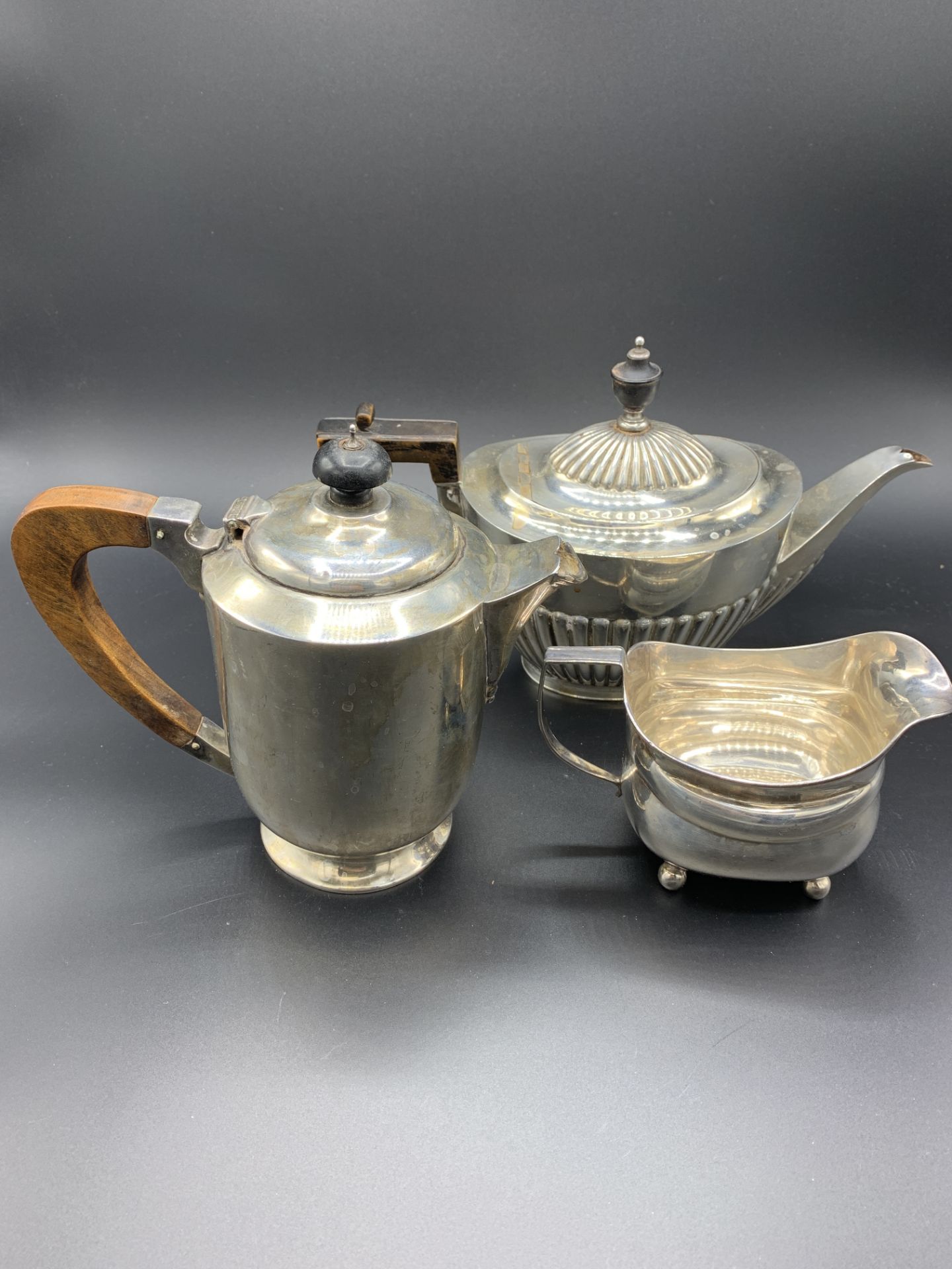 A silver teapot, a silver coffee pot and a Georgian silver cream jug