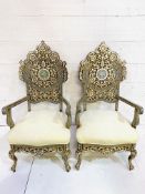 Pair of open armchairs profusely decorated with mother of pearl