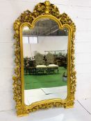 Very large ornately carved gilt wood framed arch top wall mirror