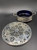 A silver mounted circular glass stand by Mappin & Webb and a silver two handled three footed dish