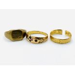 15ct ring, 18ct gold band, and a yellow metal ring,