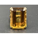 18ct gold ring set with an emerald cut brandy citrine