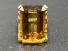 18ct gold ring set with an emerald cut brandy citrine