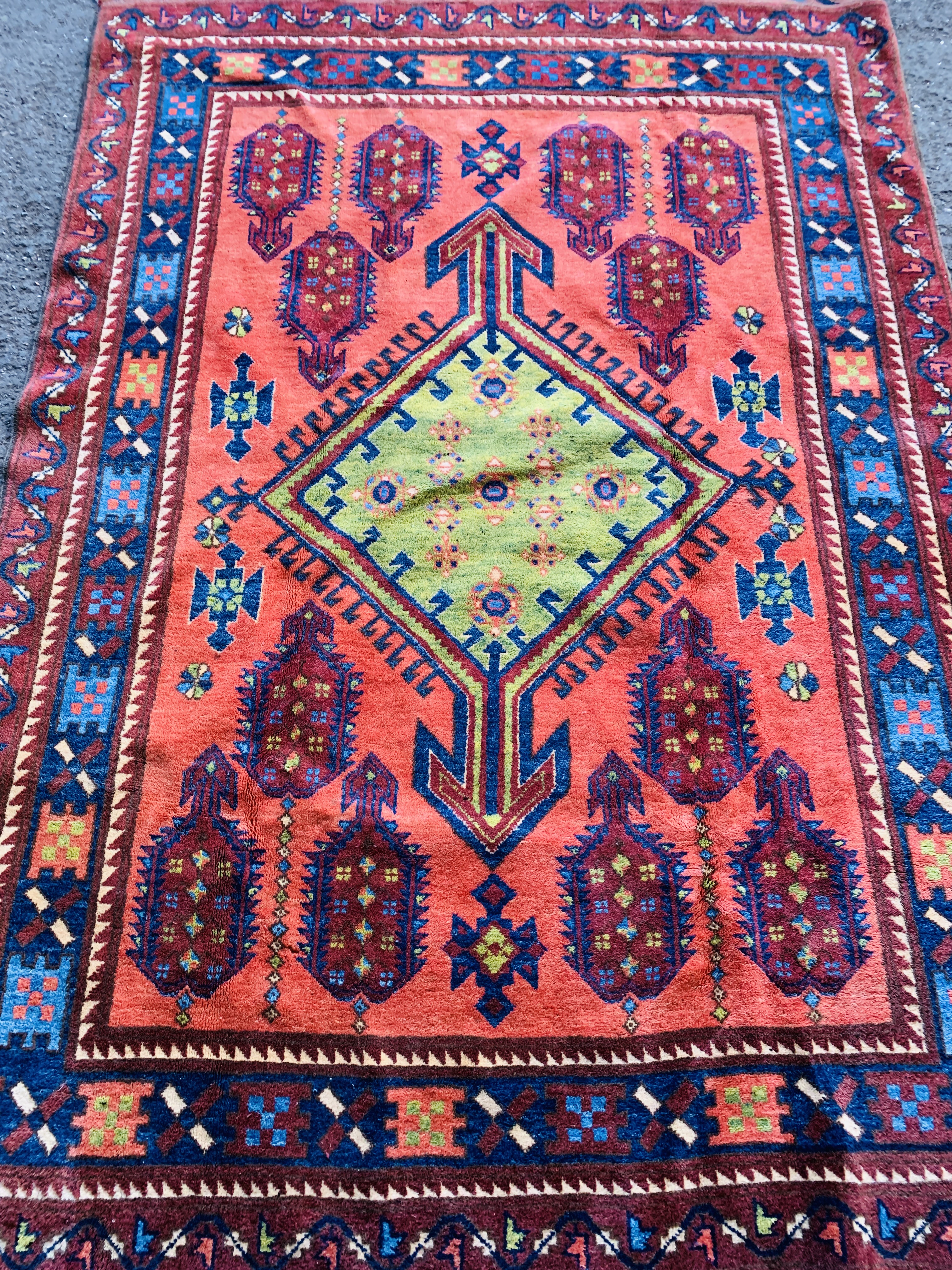 Red ground patterned rug