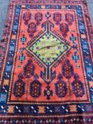 Red ground patterned rug