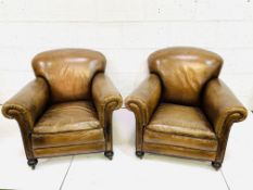 Pair of brown leather club chairs