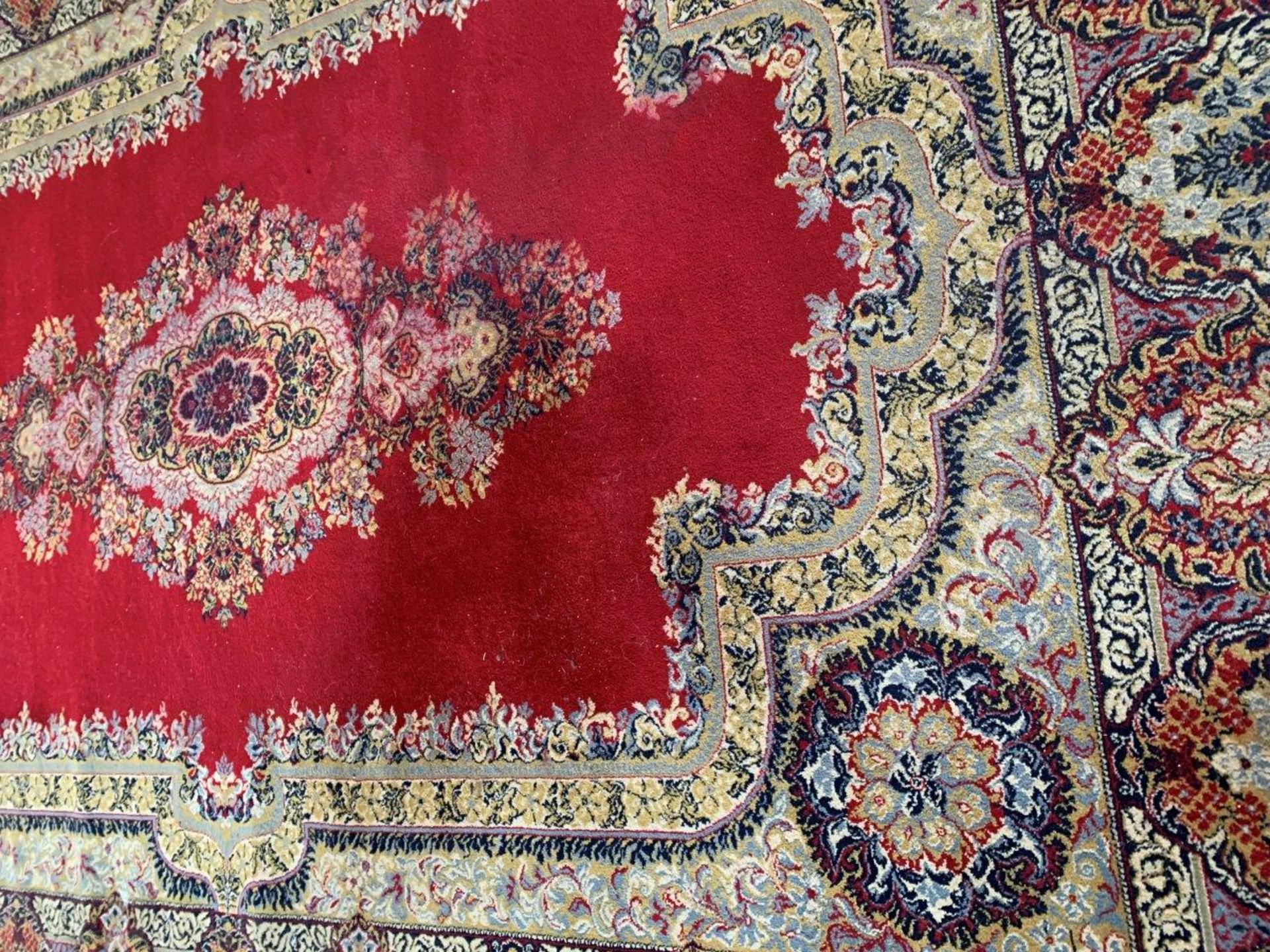 Dark red ground patterned carpet - Image 4 of 4