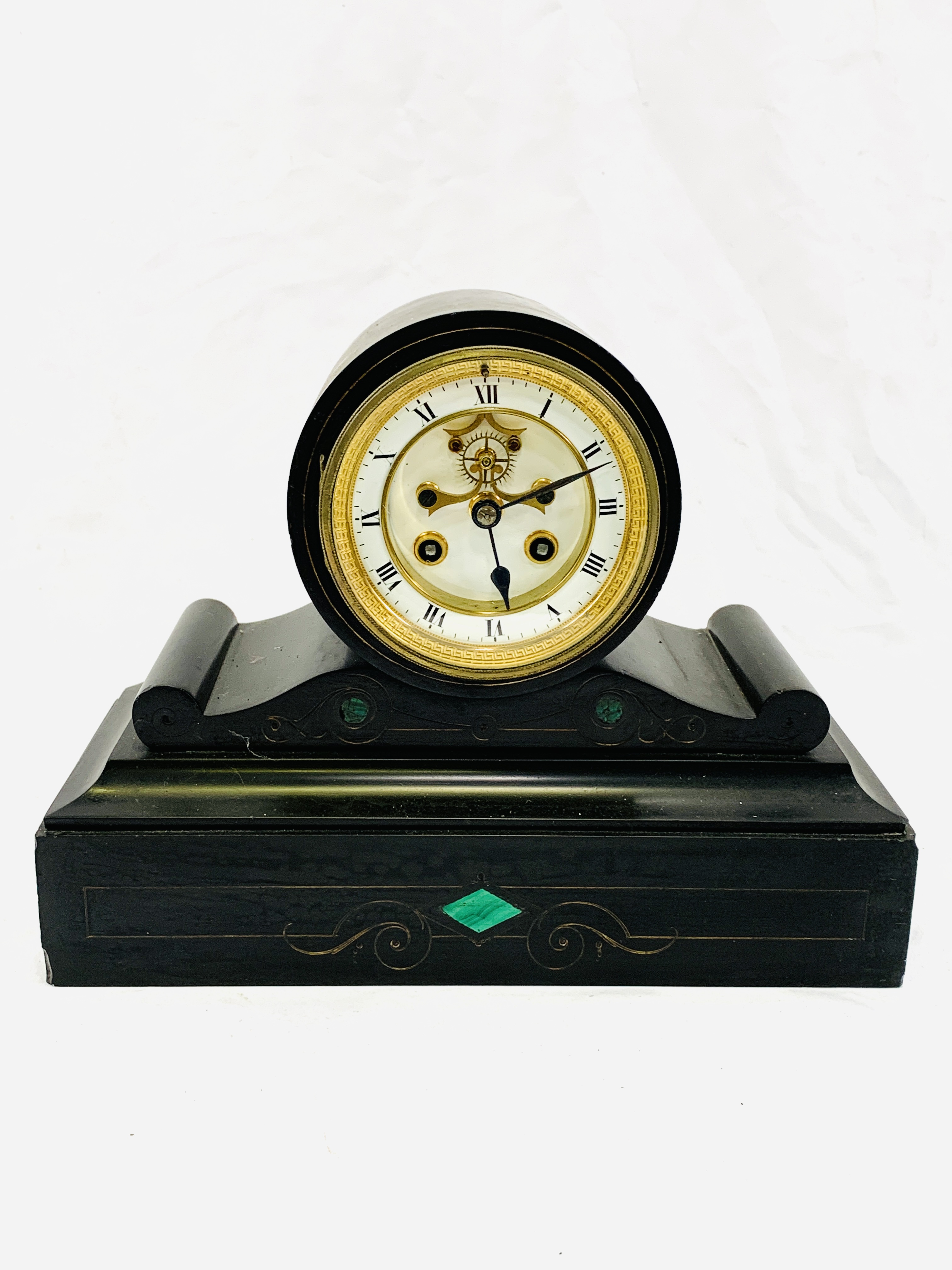 A slate cased mantel clock