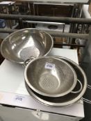 Four round colanders