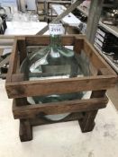 Glass jug in crate