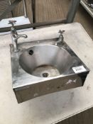 Hand sink with taps