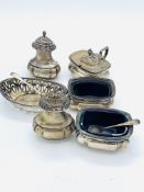 A silver cruet set and a silver pierced sided dish