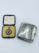 A silver cigarette case and a silver and black enamel medal inscribed 'Camberwell Grammar School'
