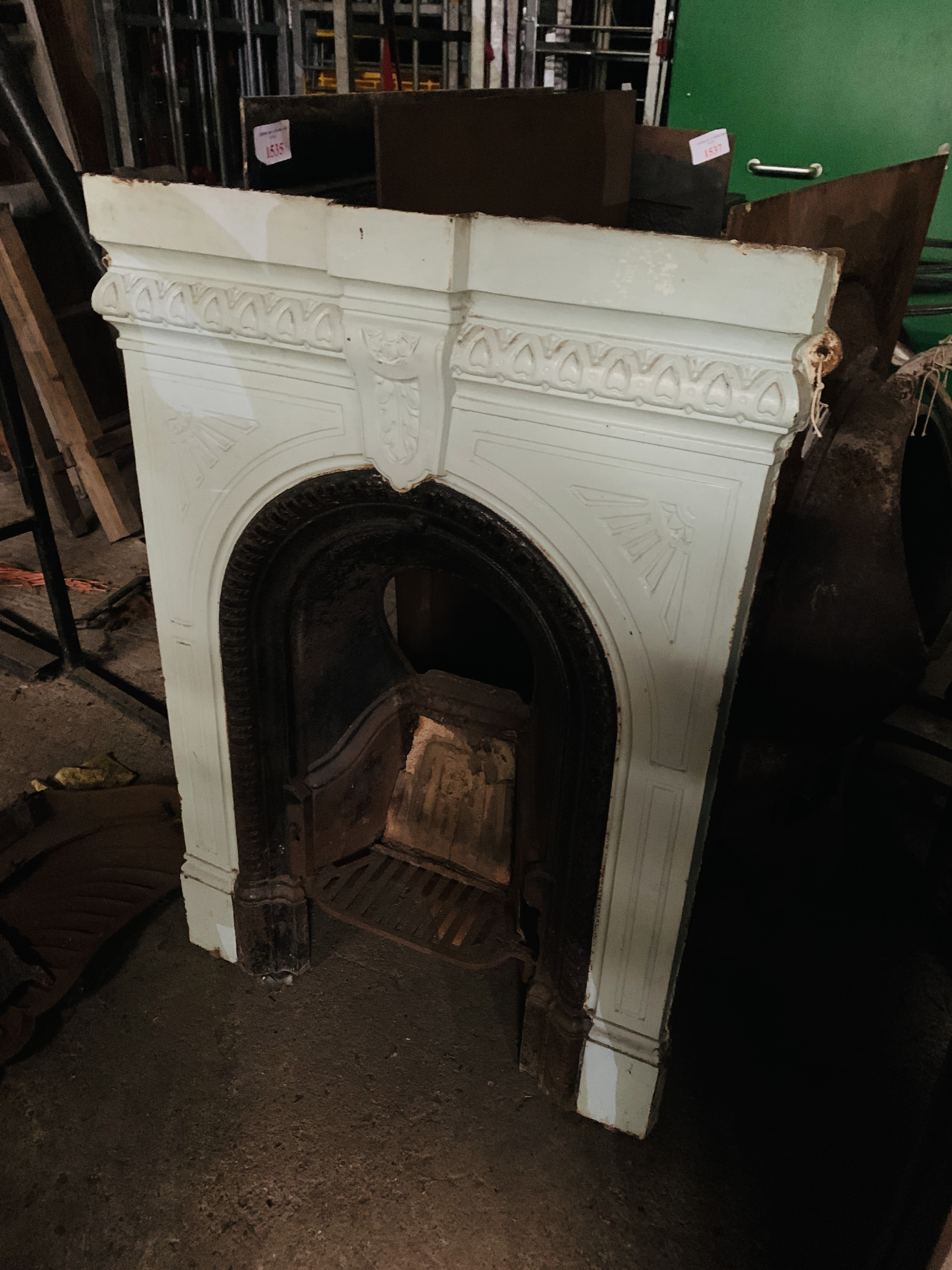 Cast iron fireplace with grate circa 1900