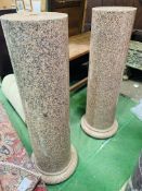 A pair of rose marble columns