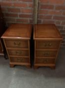 A pair of reproduction 3 drawer bedside cabinets