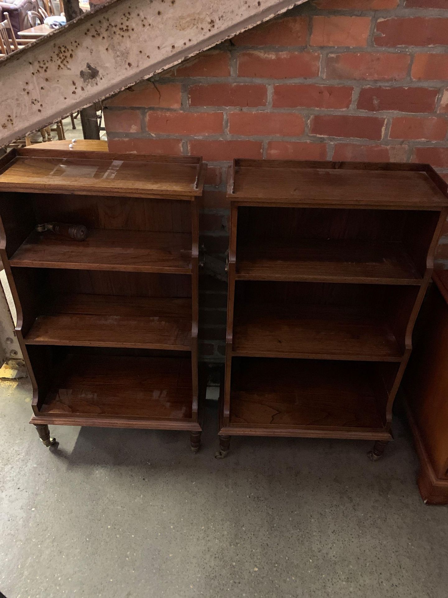 A pair of oak open waterfall bookcases