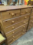 A pair of pine chests of 2 over 5 drawers