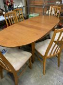 Teak oval extendable dining table with 6 matching teak rail back dining chairs
