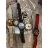 A collection of seven Swatch watches and other watches