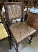 Oak framed cane chair and an upholstered tub chair