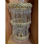 Brass effect and crystal 3 tier chandelier