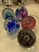 Collection of 4 Caithness glass paperweights, and one other