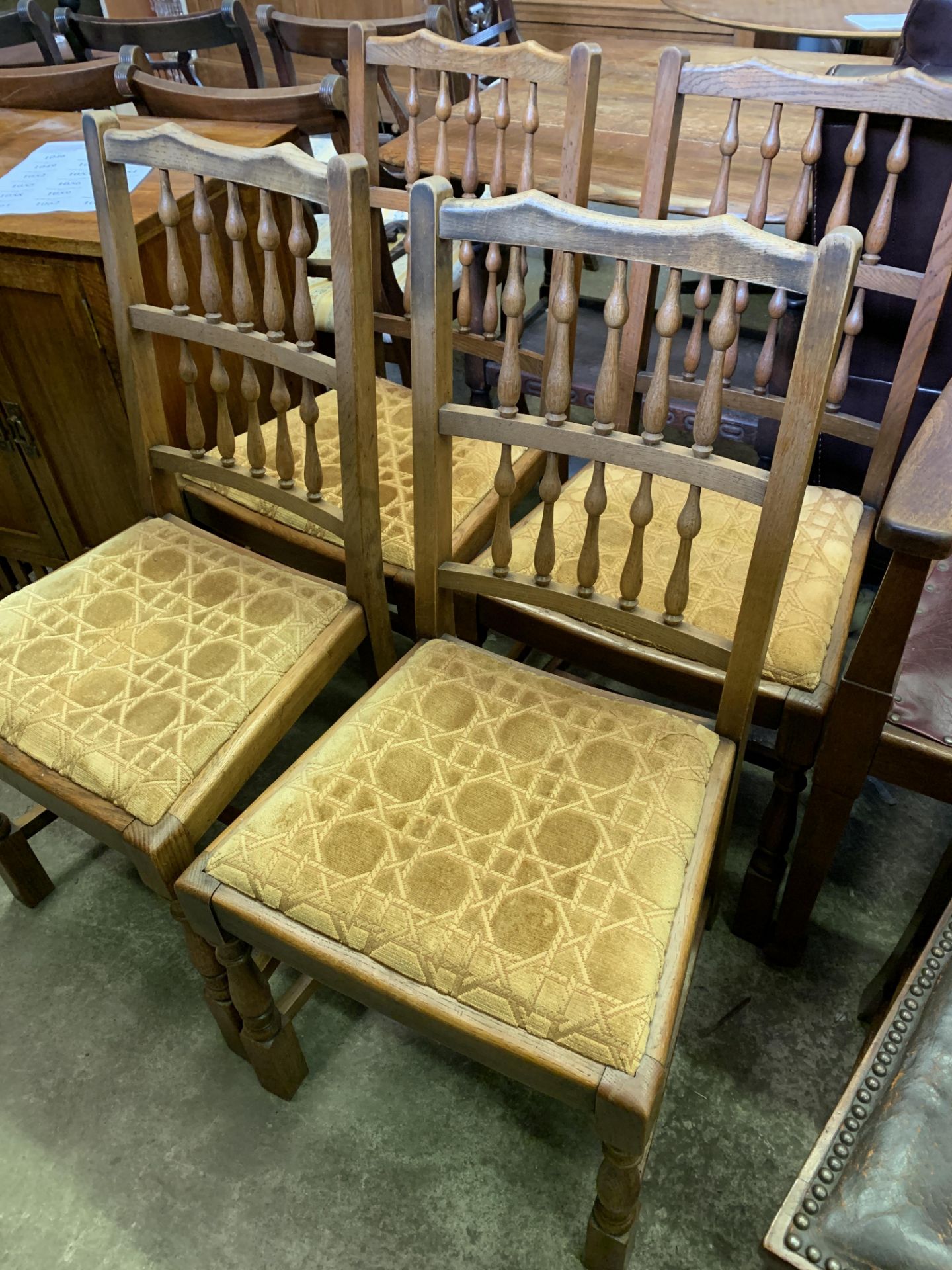 Four oak framed spindle back dining chairs