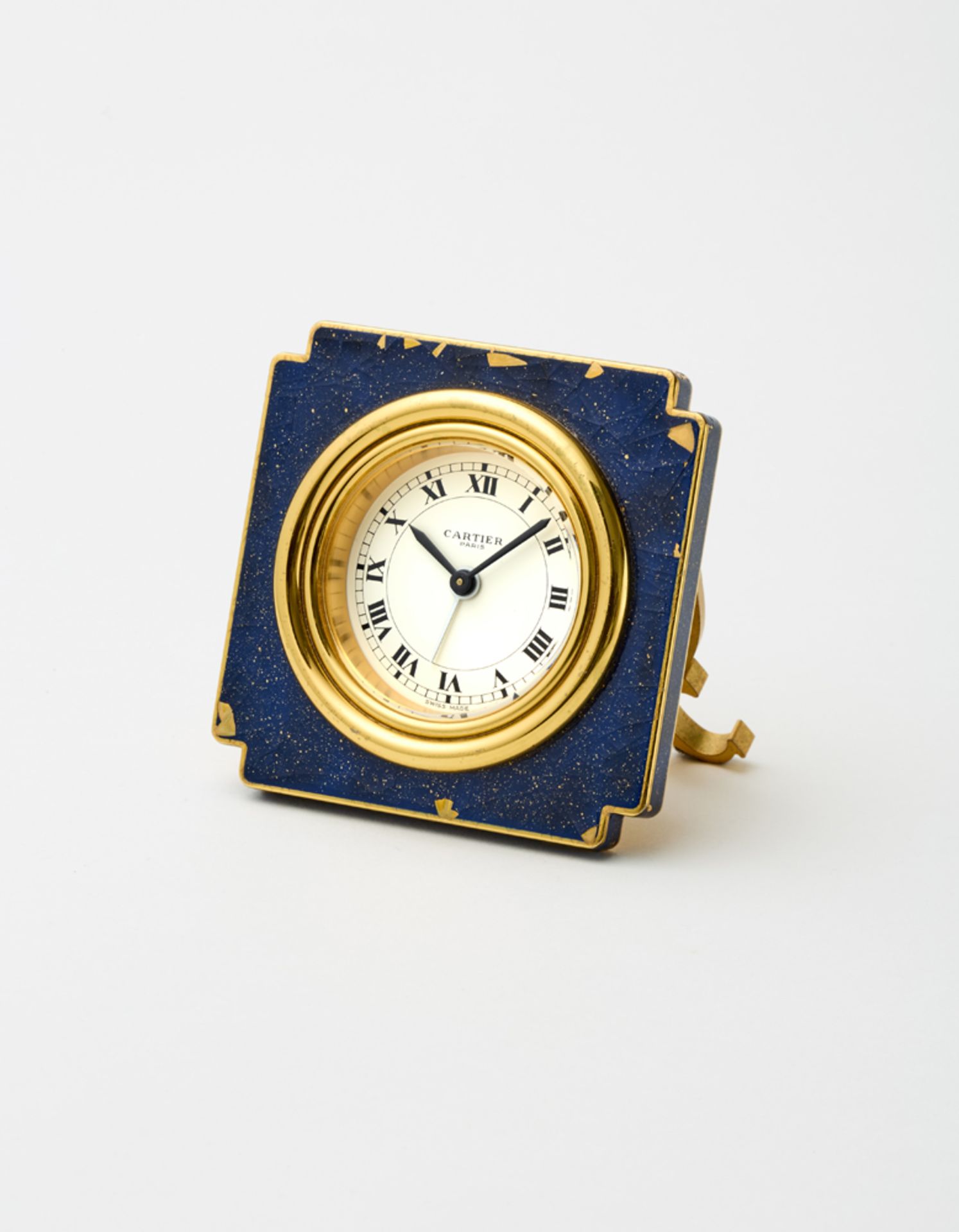 CARTIERLacquered gilt brass alarm clock with square-shaped case with mechanical movement.70s of
